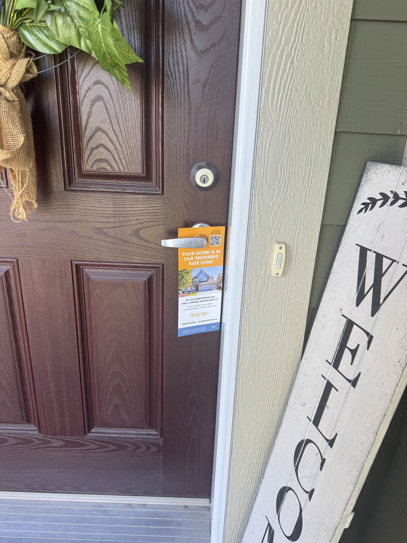 A door hanger StreetDrop delivered, hanging on a Calgary front door handle