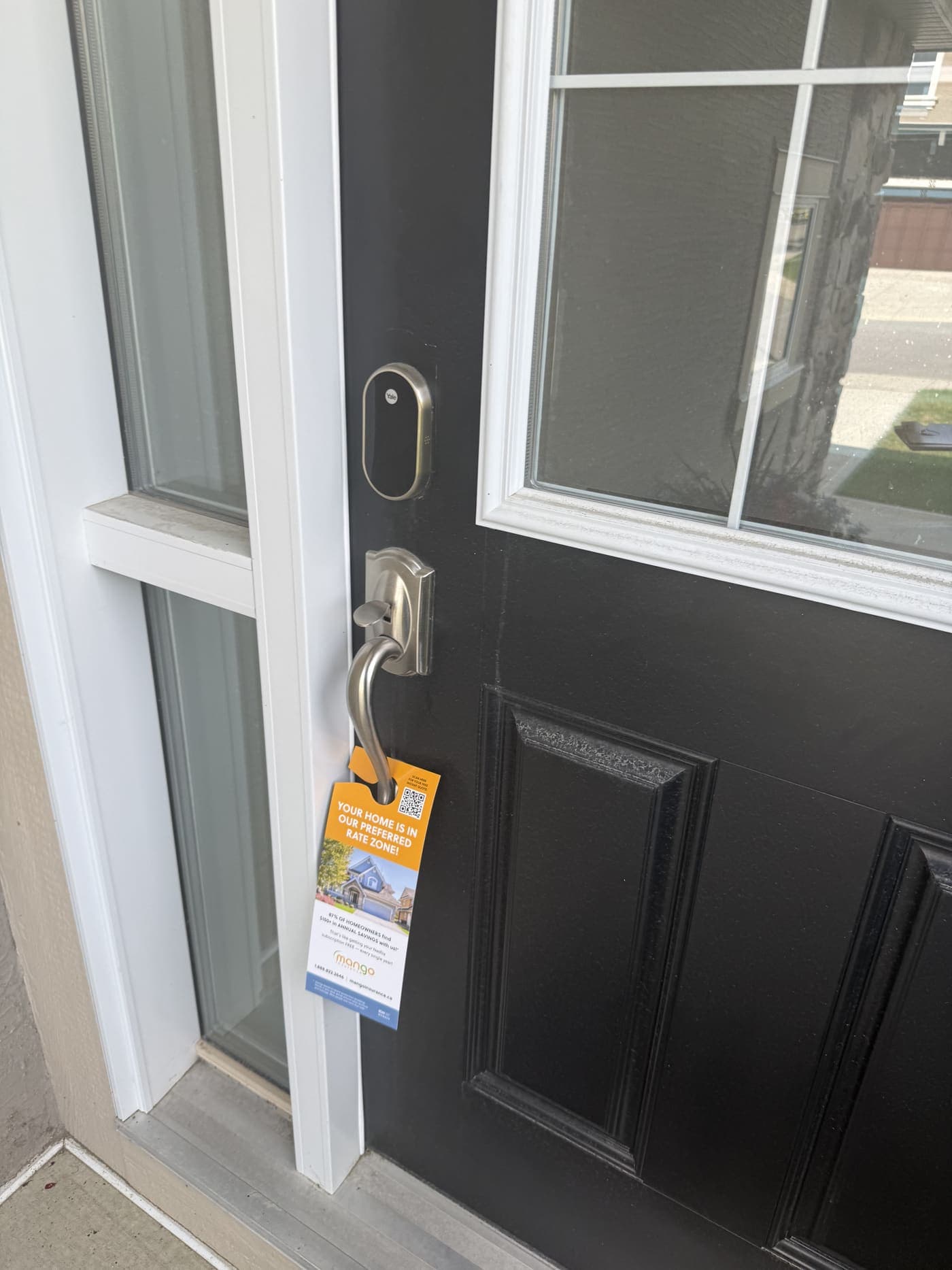 A door hanger StreetDrop delivered, hanging on a Calgary front door handle